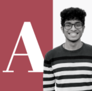A boy smiling with letter A